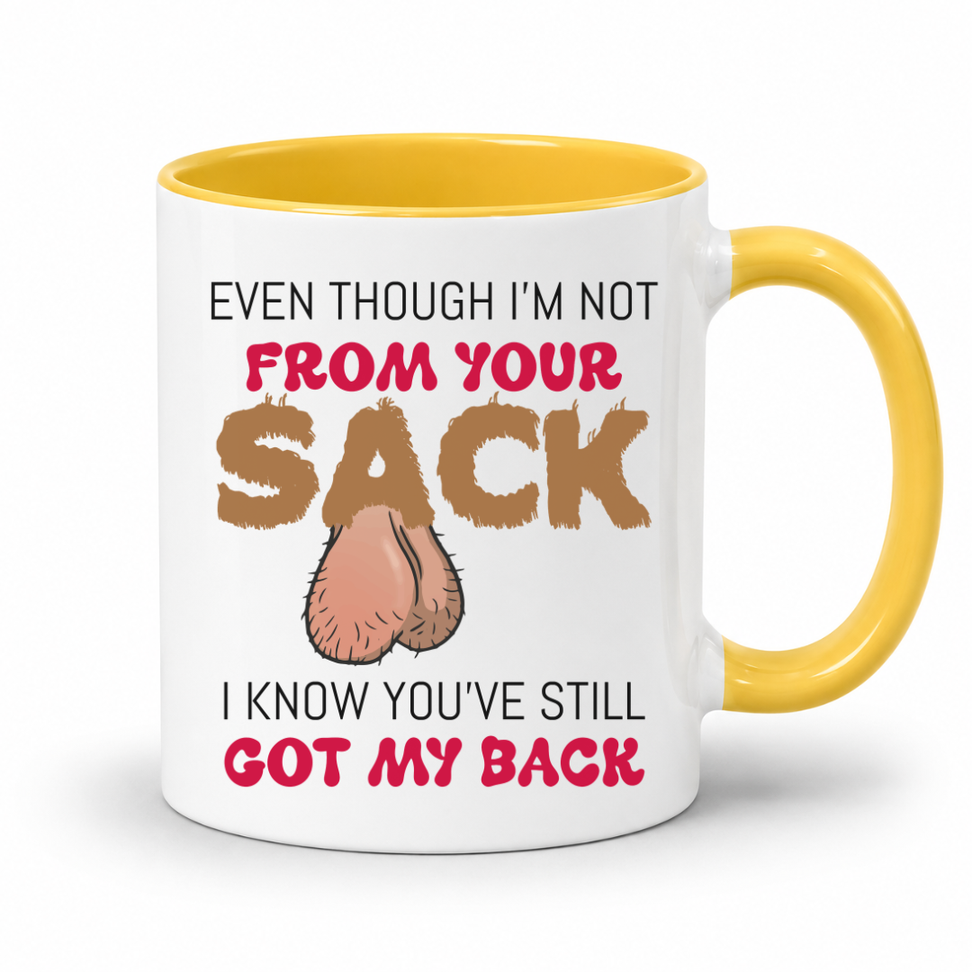 A white ceramic mug with a yellow interior and handle, featuring a humorous graphic with the text 'EVEN THOUGH I'M NOT FROM YOUR SACK I KNOW YOU'VE STILL GOT MY BACK' and a cartoon drawing of ball bags. Grab yours from Coffee and Moo NZ.