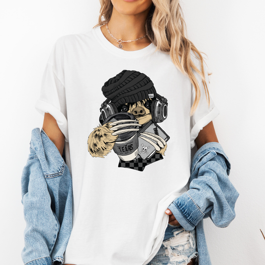 A woman wearing a white short-sleeve graphic t-shirt with a stylized Emo sloth wearing a beanie, headphones, and holding a coffee cup with the word "TEARS" on it. Grab your tee from Coffee and Moo NZ.