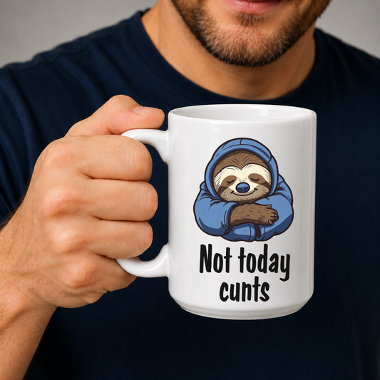 A man holding a white ceramic mug with a cartoon sloth wearing a blue hoodie and the text 'Not today cunts' printed on it. The man is wearing a dark navy blue t-shirt against a neutral gray background. from Coffee and Moo.