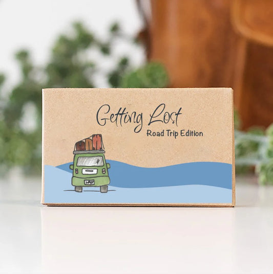 Instead of arguing over directions, you'll let passing cars, the digits on your odometer, and roadside dandelions navigate your next turn. Getting Lost Road Trip Edition Adventure Card Game, featuring 26 direction + activity cards. Grab yours for your next road trip from Coffee and Moo NZ