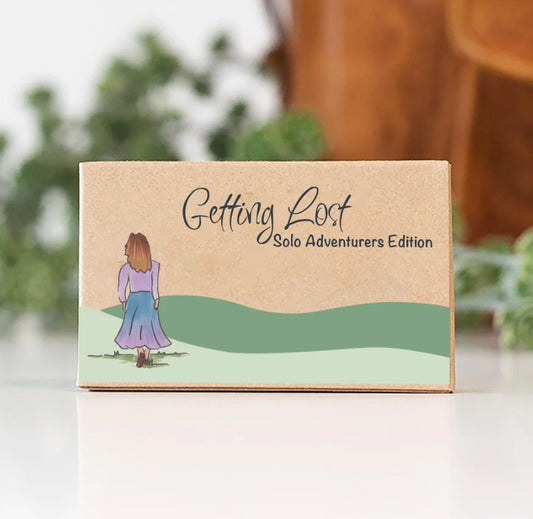 The Getting Lost Solo Adventurers Edition is your ultimate permit to escape the noise, skip the group compromises, and explore the world entirely at your own pace. Grab your game from Coffee and Moo NZ