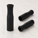 Three black rubber straw tips shown from different angles, designed to fit reusable drinking straws. from coffee and moo nz.