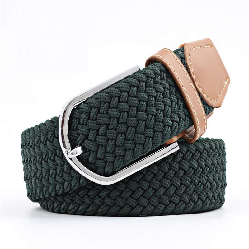 Dark green woven belt with a brown faux leather trim and silver buckle on a white background. Purchase from Coffee and Moo
