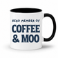 A white ceramic coffee mug with a black handle and black interior, featuring the printed text 'HERD MEMBER OF COFFEE & MOO' in dark blue lettering on the front. Grab your mug from Coffee and Moo NZ.