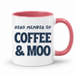 A white ceramic coffee mug with a pink interior and handle, featuring the printed text 'HERD MEMBER OF COFFEE & MOO' in dark blue lettering, set against a plain white background. Grab your mug from Coffee and Moo NZ.