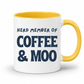 A white ceramic coffee mug with a yellow interior and yellow handle, printed with the text 'HERD MEMBER OF COFFEE & MOO' in dark navy blue lettering, on a white background. Grab your mug from Coffee and Moo NZ.