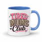 A white ceramic mug with a blue interior and handle, featuring the text 'TIRED MUMS Club' in pink, leopard print, and black lettering on the front. Grab your mug from Coffee and Moo NZ.