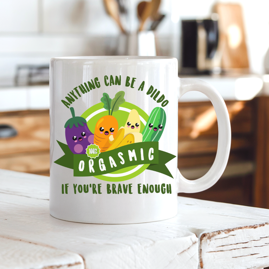 Anything Can Be a Dildo funny coffee mug on a country kitchen bench, featuring colourful cartoon vegetables and the cheeky adult humour saying, from Coffee & Moo.
