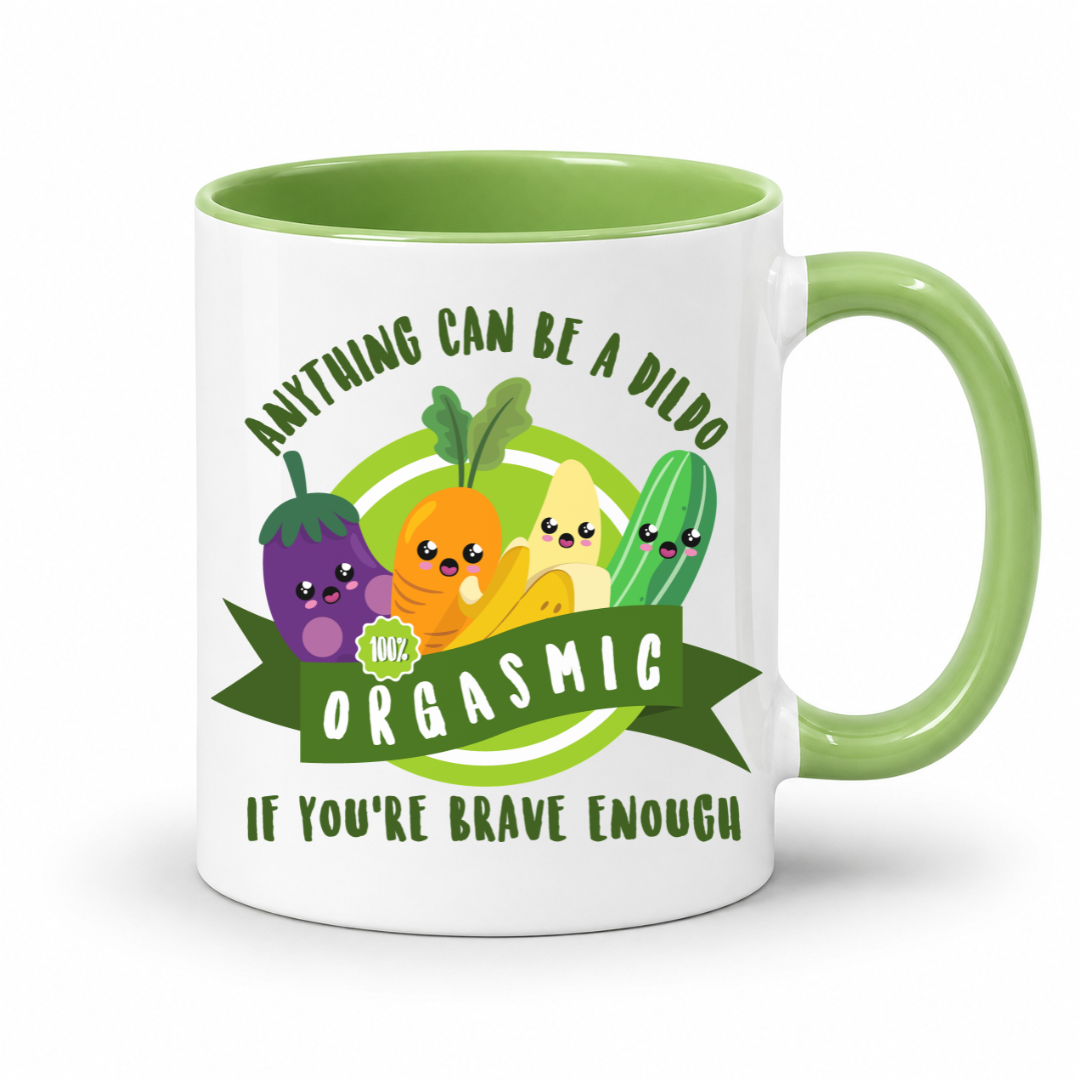 A white mug with a green inner and handle, featuring an image of smiling cartoon vegetables and the words "Anything Can Be a Dildo If You're Brave Enough", Grab yours from from Coffee & moo nz.