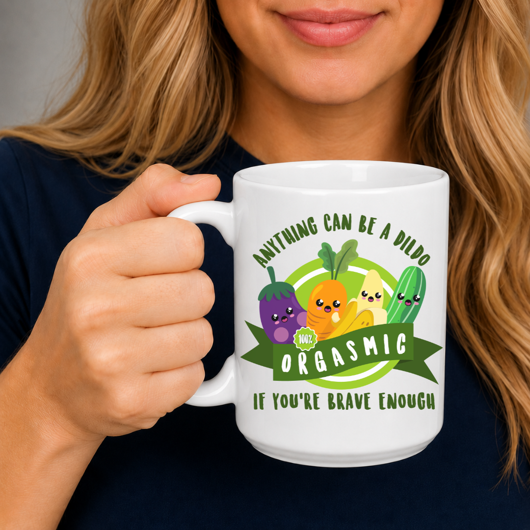 Female holding Anything Can Be a Dildo funny coffee mug, featuring smiling cartoon vegetables and the inappropriate humour design, from Coffee & Moo.