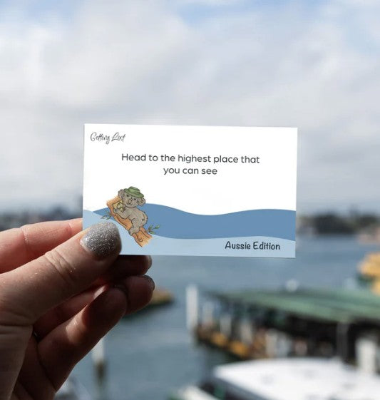 A card from the Getting Lost Aussie Edition Adventure Card Game featuring the text "head to the highest place that you can see" Purchase yours from Coffee and Moo NZ.