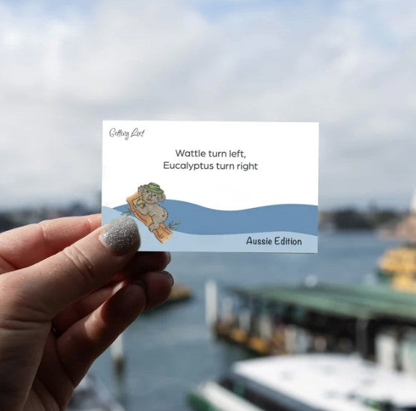 A card from the Getting Lost Aussie Edition Adventure Card Game featuring the text "wattle turn left, eucalyptus turn right" Purchase yours from Coffee and Moo NZ.