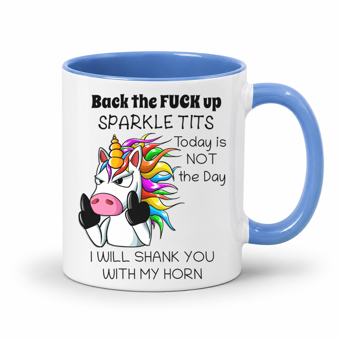 A white mug with Blue handle and inner  featuring a humorous graphic of a cartoon unicorn and the text 'Back the FUCK up SPARKLE TITS Today is NOT the Day I WILL SHANK YOU WITH MY HORN', shown on a white background. Grab yours from Coffee and Moo.