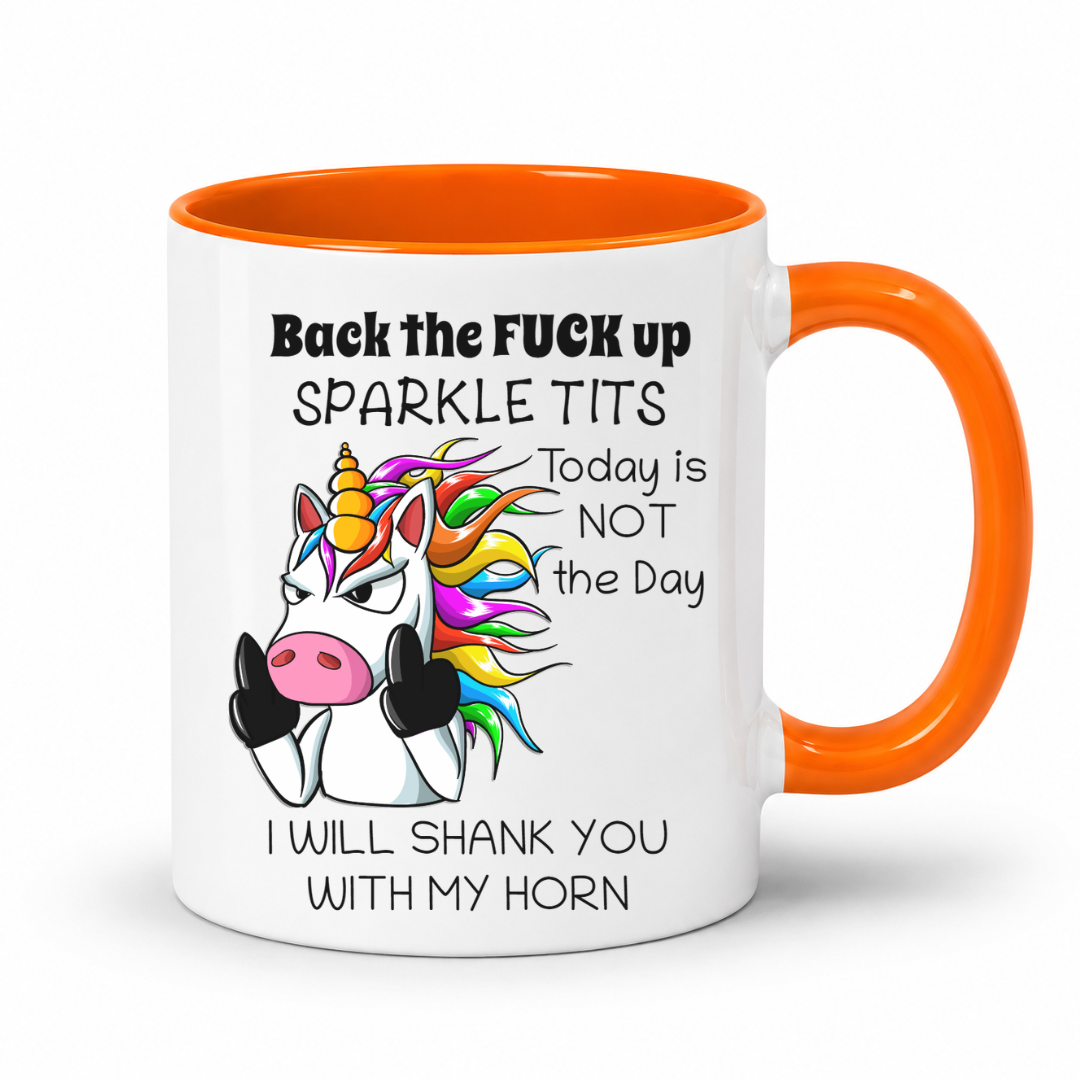 A white ceramic coffee mug with a bright orange handle and interior, featuring a cartoon unicorn with a rainbow mane and bold black text that reads, 'Back the FUCK up SPARKLE TITS Today is NOT the Day I WILL SHANK YOU WITH MY HORN.'. from coffee and moo nz.