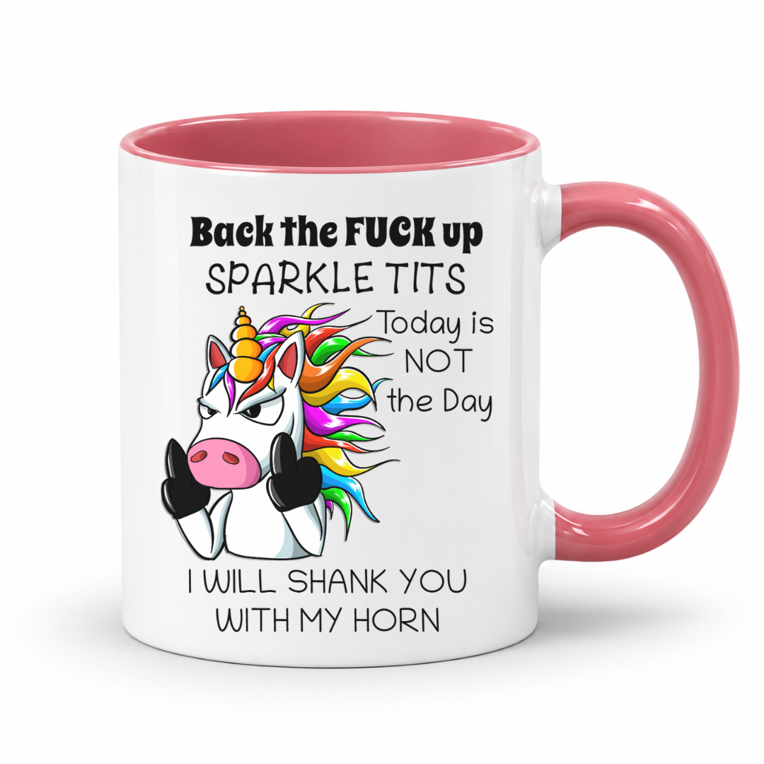 A white ceramic coffee mug with a pink interior and handle, featuring a cartoon unicorn with a rainbow mane and bold black text that reads, 'Back the FUCK up SPARKLE TITS Today is NOT the Day I WILL SHANK YOU WITH MY HORN.'. from coffee and moo nz.