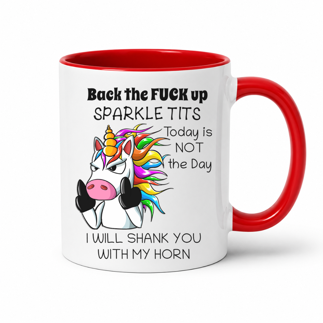 A white ceramic mug with a red interior and red handle, featuring a cartoon angry unicorn with a rainbow mane and bold black text that reads, 'Back the FUCK up SPARKLE TITS Today is NOT the Day I WILL SHANK YOU WITH MY HORN.'. from coffee and moo nz.