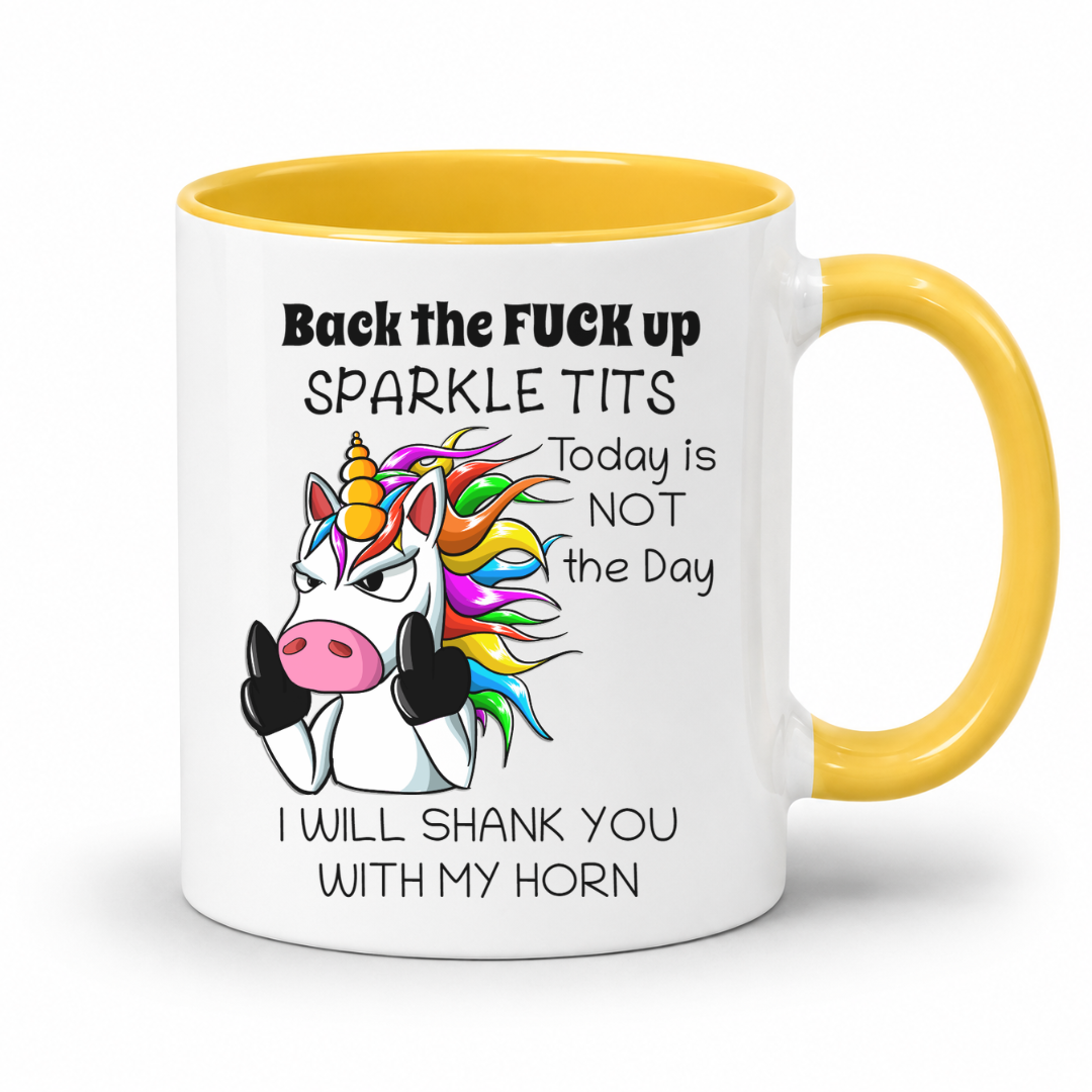 A white mug with yellow handle and inner  featuring a humorous graphic of a cartoon unicorn and the text 'Back the FUCK up SPARKLE TITS Today is NOT the Day I WILL SHANK YOU WITH MY HORN', shown on a white background. Grab yours from Coffee and Moo.
