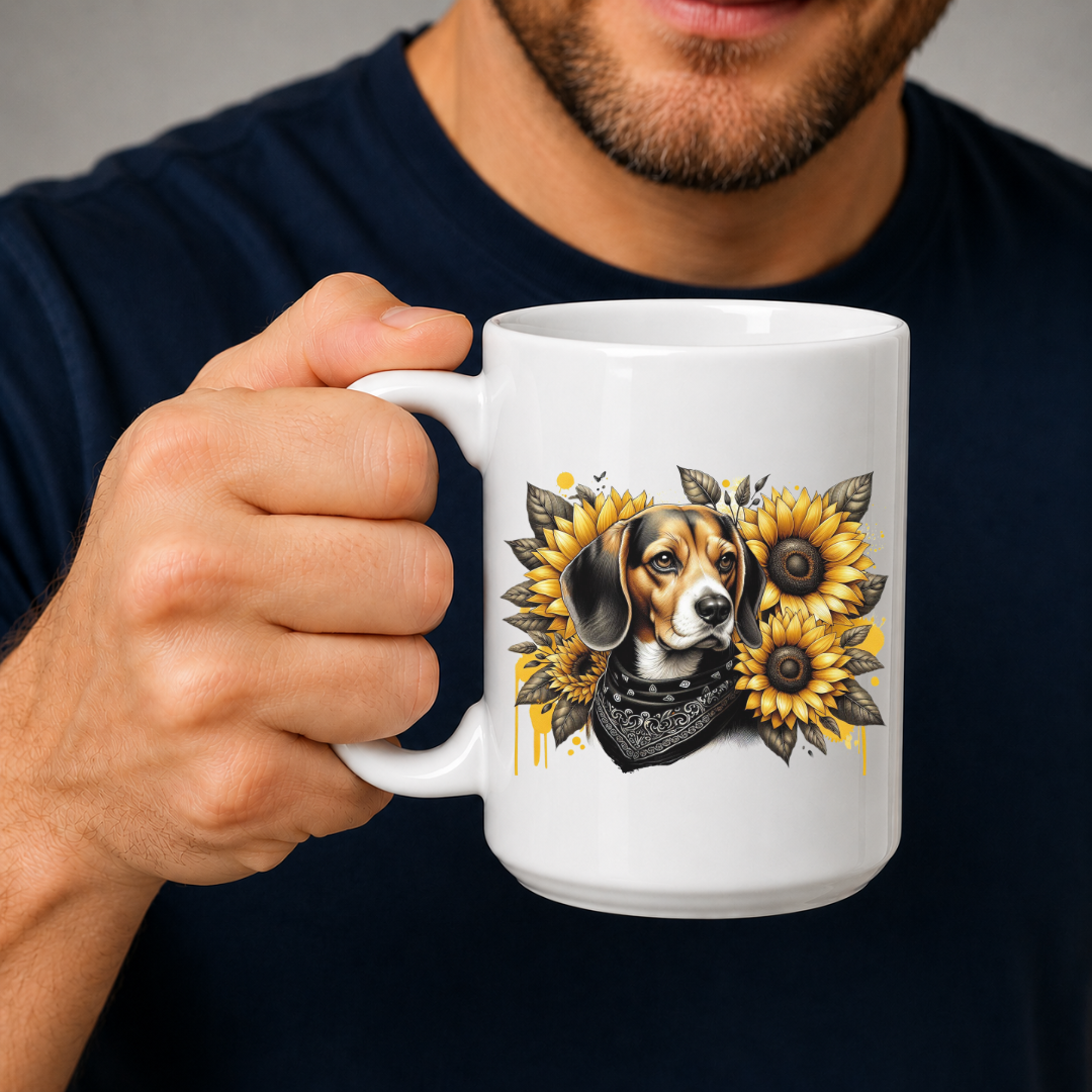A person holding a white ceramic mug with a detailed graphic of a beagle dog surrounded by yellow sunflowers and a black bandana. The person is wearing a dark navy blue t-shirt against a neutral grey background. Grab your mug from Coffee and Moo NZ.