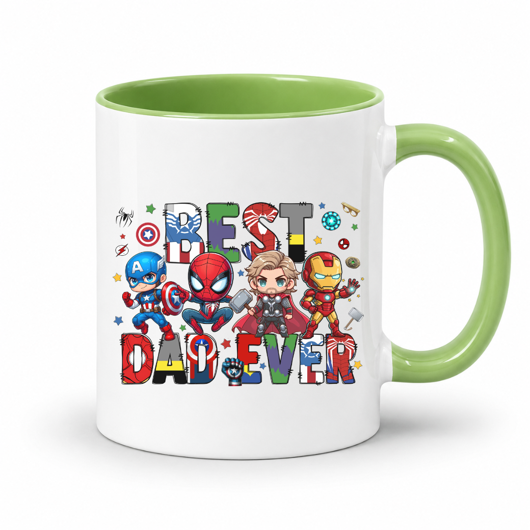 A white ceramic mug with a light green interior and handle, featuring a colorful graphic of chibi Marvel superheroes and the text 'BEST DAD EVER'. Grab yours from Coffee and Moo.