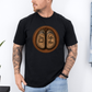 A man wearing a black short-sleeve graphic t-shirt with a circular print of two brown cow hooves reading 'Stay Feral' and 'Coffee Moo'.  Grab your official Coffee & Moo brand tee from Coffee and Moo NZ.