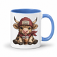 A white ceramic coffee mug with a blue interior and handle, featuring a cartoon illustration of a cute Highland cow wearing a red beanie that says 'COFFEE LOVER' and holding a drink. from Coffee and Moo.