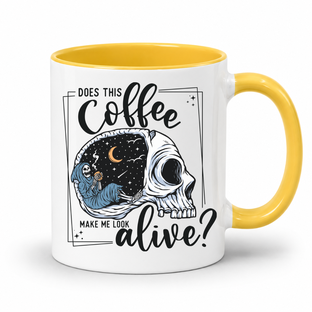 while mug with a yellow handle and inner with a graphic on it that features a skull with one half showing a starry night sky with a crescent moon and a skeleton holding a coffee, accompanied by the text 'DOES THIS Coffee MAKE ME LOOK alive?'. Grab yours from Coffee and Moo NZ.