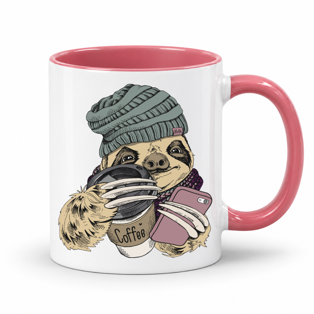 A white ceramic coffee mug with a pink interior and handle, featuring a cartoon sloth wearing a knit beanie and scarf while holding a coffee cup and a pink smartphone. Grab your mug from Coffee and moo NZ.