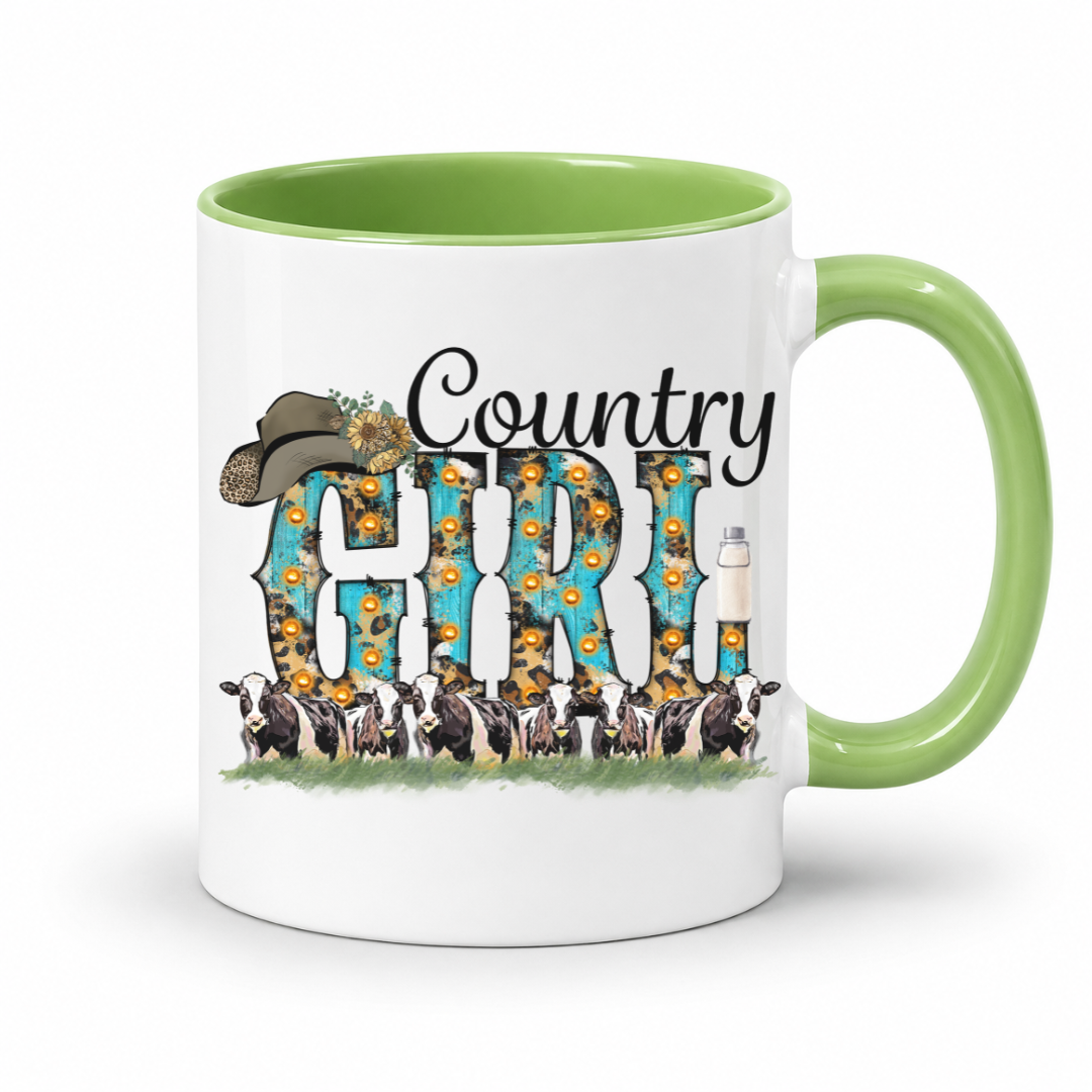 A white ceramic coffee mug with a light green interior and handle, featuring a 'Country Girl' graphic with a cowboy hat, sunflowers, and dairy cows.  From Coffee and Moo NZ