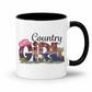 A white ceramic mug with a black interior and handle, featuring a 'Country Girl' graphic design on the front with a pink cowboy hat, plaid pattern, horse, boots and cowgirl illustrations. From Coffee and Moo NZ.