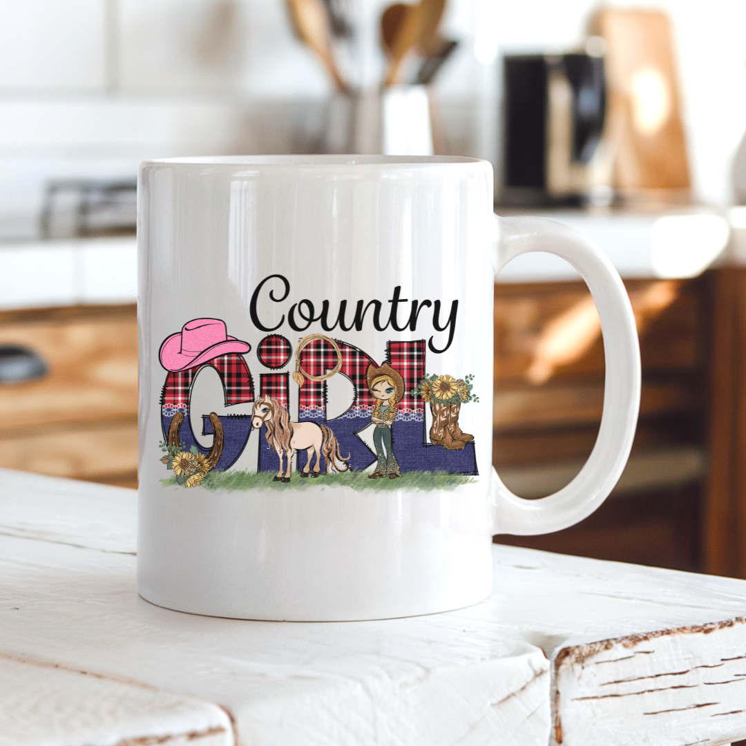 A white ceramic coffee mug with a 'Country Girl' graphic print, sitting on a rustic white wooden table with a blurred kitchen background. From Coffee and Moo NZ.