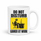 Do Not Disturb Gamer at Work gaming coffee mug featuring, bold black lettering and a yellow and black graphic of a gamer at a computer, from Coffee and Moo.