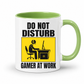 Do Not Disturb Gamer at Work gaming coffee mug featuring green inner & handle, bold black lettering and a yellow and black graphic of a gamer at a computer, from Coffee and Moo.