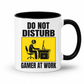 Do Not Disturb Gamer at Work gaming coffee mug featuring black inner & handle, bold black lettering and a yellow and black graphic of a gamer at a computer, from Coffee and Moo.