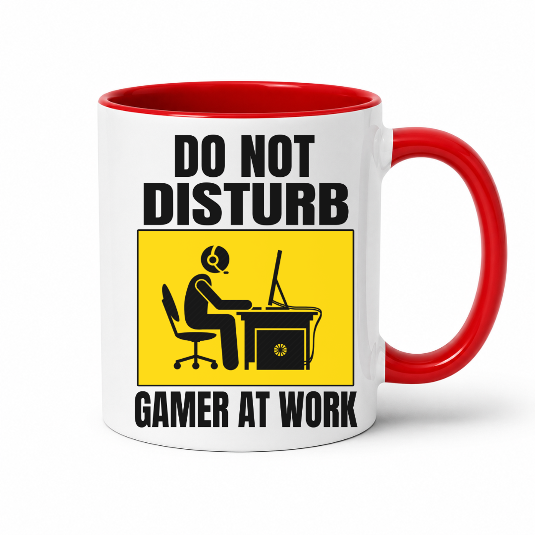 Do Not Disturb Gamer at Work gaming coffee mug featuring red inner & handle, bold black lettering and a yellow and black graphic of a gamer at a computer, from Coffee and Moo.