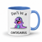 A white ceramic coffee mug with a blue handle and blue interior, featuring a cartoon purple dinosaur graphic and the text 'Don't be a CUNTASAURUS' printed on the front. Grab yours from Coffee and Moo NZ.