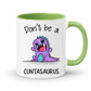 A white ceramic mug with a light green interior and handle, featuring a cartoon purple dinosaur graphic with the text 'Don't be a CUNTASAURUS' printed on the front. Grab yours from Coffee and Moo NZ.