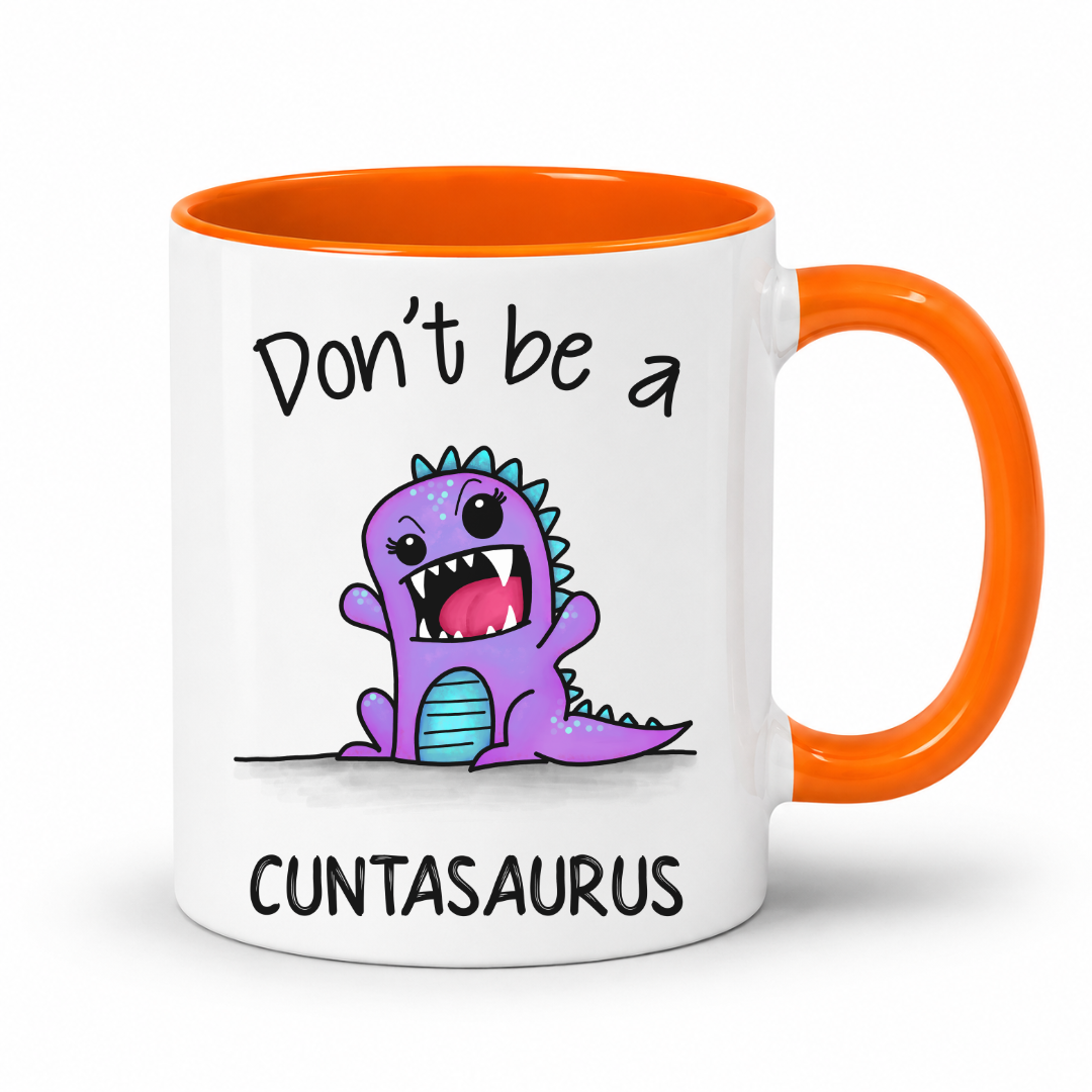 A white ceramic mug with a bright orange handle and interior, featuring a cartoon purple dinosaur graphic and the text 'Don't be a CUNTASaurus' printed on the front. Grab yours from Coffee and Moo NZ.