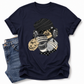 A navy blue short-sleeve t-shirt with a graphic of a sloth wearing a beanie, headphones, and holding a cup of coffee, styled flat-lay next to a pair of blue jeans on a white background. Grab your emo sloth tee from Coffee and Moo NZ.