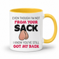 A white ceramic mug with a yellow interior and handle, featuring a humorous graphic with the text 'EVEN THOUGH I'M NOT FROM YOUR SACK I KNOW YOU'VE STILL GOT MY BACK' and a cartoon drawing of hairy balls. Grab yours from Coffee and Moo NZ.