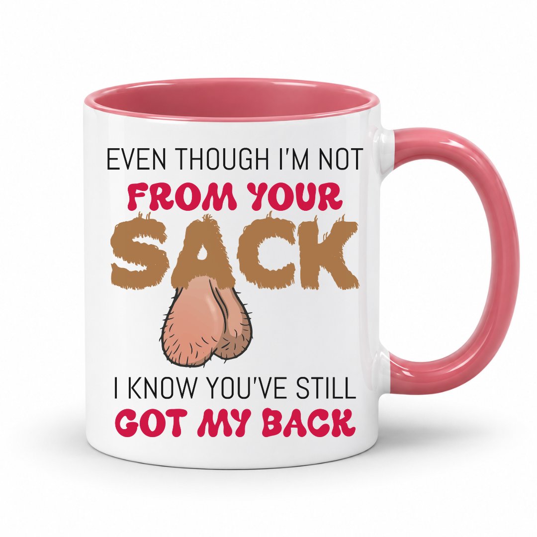 A white ceramic mug with a pink interior and handle, featuring a humorous graphic with the text 'EVEN THOUGH I'M NOT FROM YOUR SACK I KNOW YOU'VE STILL GOT MY BACK' and a cartoon drawing of ball bags. Grab yours from Coffee and Moo NZ.