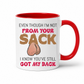 A white ceramic mug with a red interior and handle, featuring a humorous graphic with the text 'EVEN THOUGH I'M NOT FROM YOUR SACK I KNOW YOU'VE STILL GOT MY BACK' and a cartoon drawing of ball bags. Grab yours from Coffee and Moo NZ.