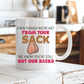 a white ceramic mug with a humorous graphic. The mug features the text 'EVEN THOUGH WE'RE NOT FROM YOUR SACK WE KNOW YOU'VE STILL GOT OUR BACKS' in brown and red lettering, accompanied by a cartoon drawing of a hairy balls. Grab your mug from Coffee and Moo NZ.