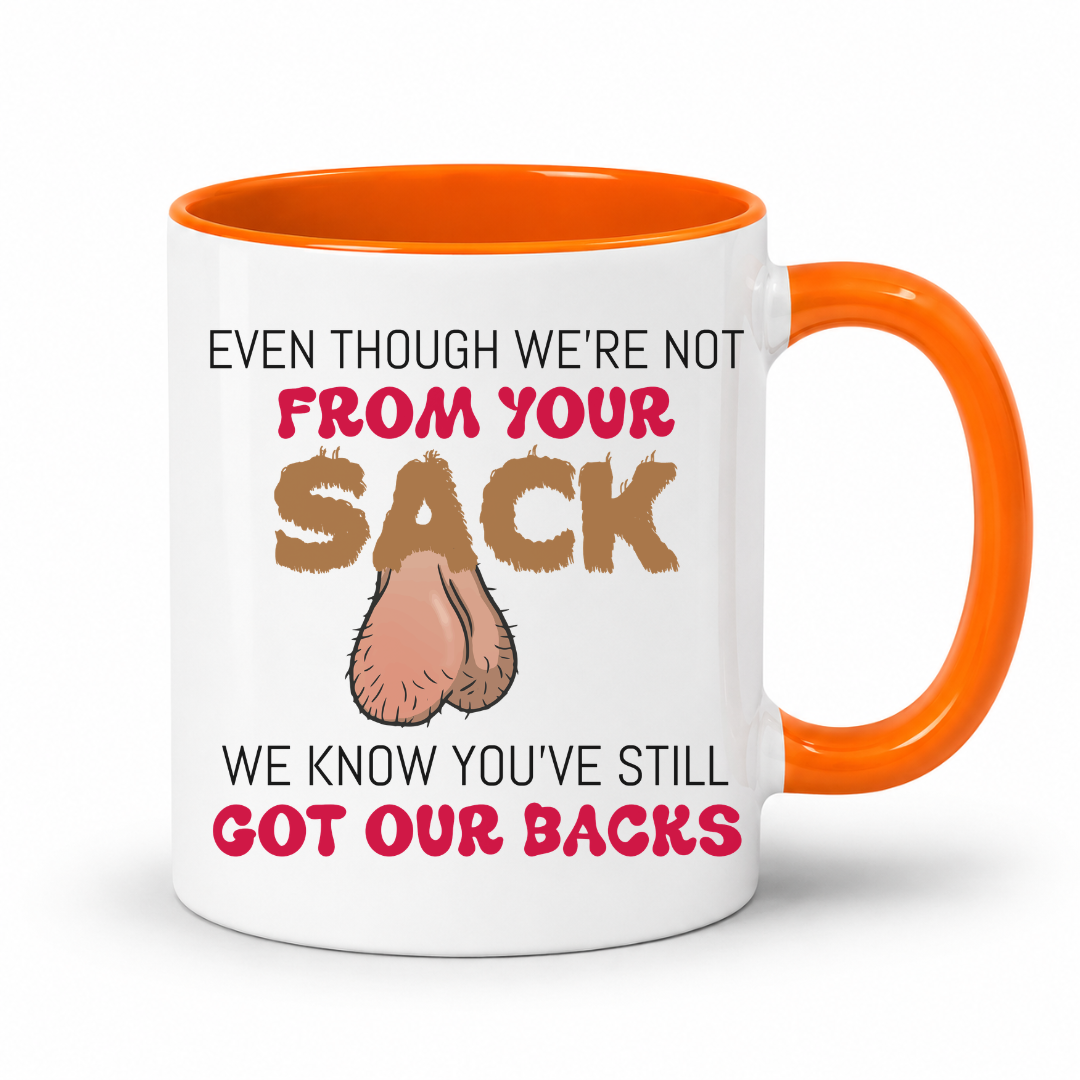 A white ceramic coffee mug with a orange interior and handle, has a humorous graphic. The mug features the text 'EVEN THOUGH WE'RE NOT FROM YOUR SACK WE KNOW YOU'VE STILL GOT OUR BACKS' in brown and red lettering, accompanied by a cartoon drawing of a hairy balls. Grab your mug from Coffee and Moo NZ.