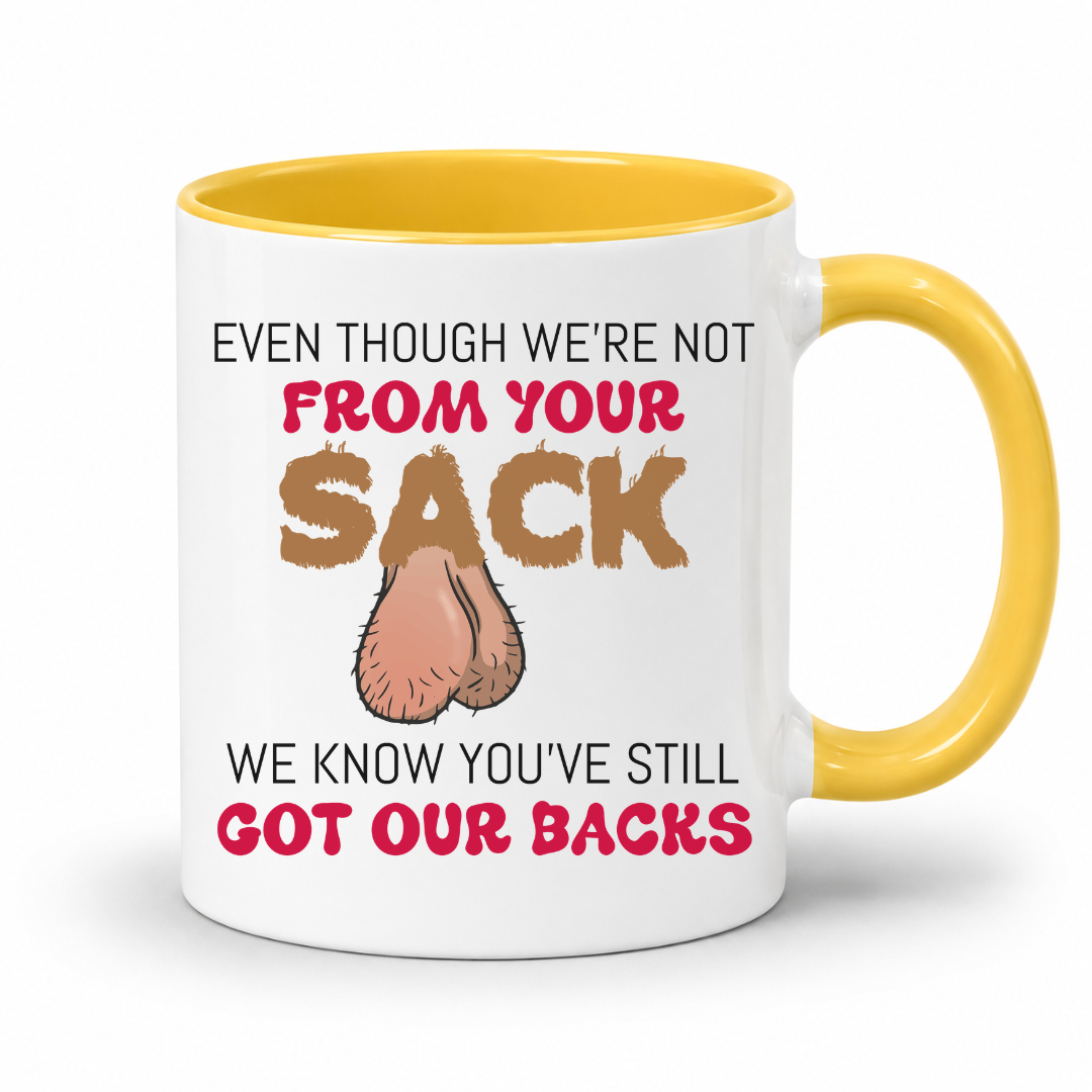 A white ceramic coffee mug with a yellow interior and handle, has a humorous graphic. The mug features the text 'EVEN THOUGH WE'RE NOT FROM YOUR SACK WE KNOW YOU'VE STILL GOT OUR BACKS' in brown and red lettering, accompanied by a cartoon drawing of a hairy balls. Grab your mug from Coffee and Moo NZ.