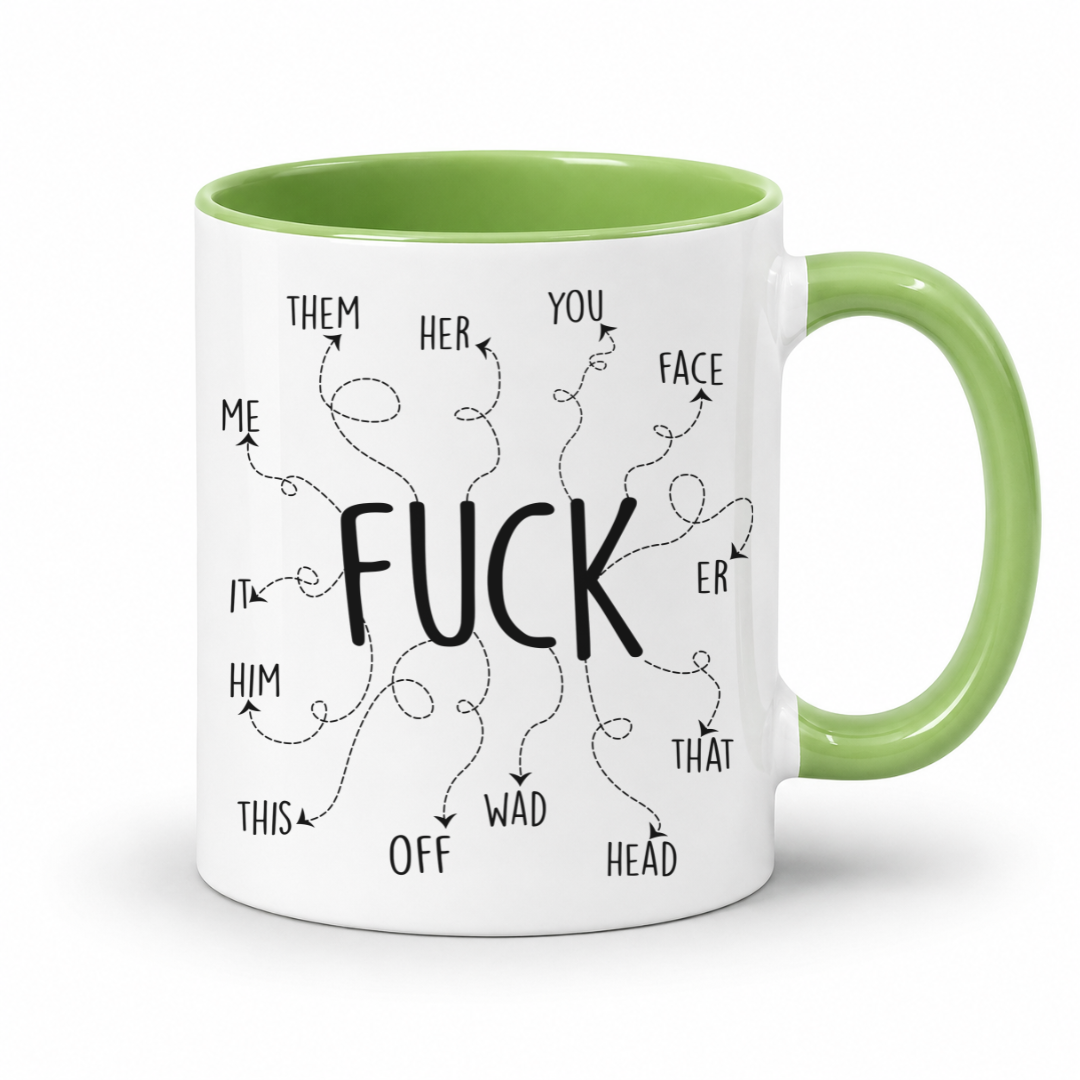 A white ceramic mug with a light green interior and handle, featuring a black graphic print of the word 'FUCK' surrounded by arrows pointing to various adjectives like 'THEM', 'HER', 'YOU', and 'FACE'. From Coffee and Moo NZ.