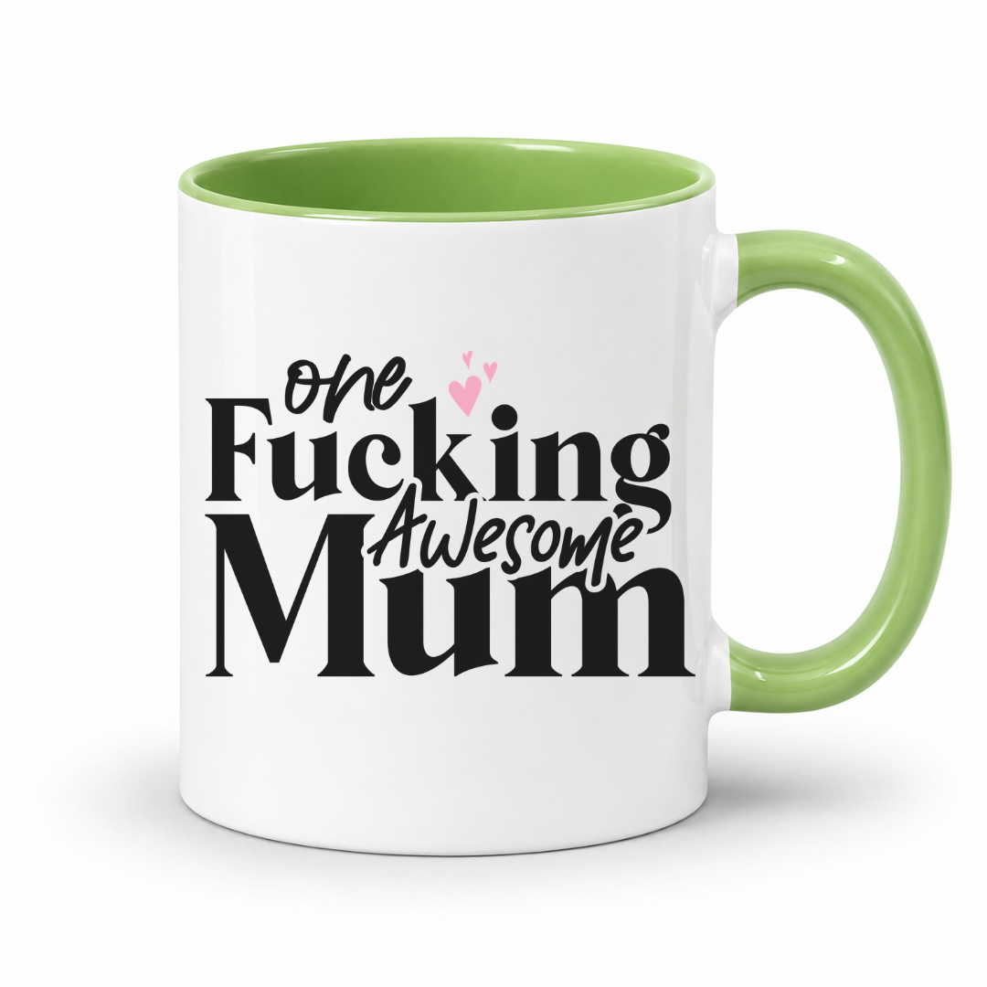 A white ceramic mug with a light green interior and handle, featuring the printed text 'One Fucking Awesome Mum' in black with two small pink hearts, on a white background. From Coffee and Moo nz