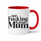 A white ceramic mug with a red interior and red handle, printed with the phrase 'one Fucking Awesome Mum' in black text with small pink hearts, on a white background. From Coffee and Moo nz