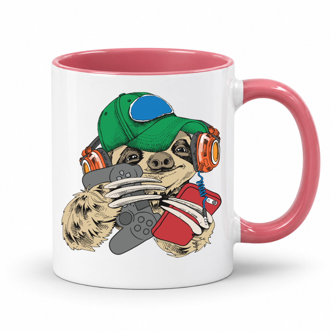 A white ceramic coffee mug with a pink interior and handle, featuring a cartoon sloth wearing a green cap and orange headphones while holding a red phone and grey game controller. Purchase your mug from Coffee and Moo NZ.