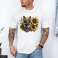 A man wearing a white short-sleeve t-shirt with a graphic print of a German Shepherd dog surrounded by yellow sunflowers, paired with light blue jeans. Grab your tee from Coffee and Moo NZ.