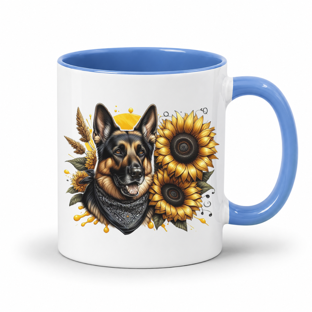 A white ceramic mug with a blue interior and handle, featuring a printed illustration of a German Shepherd dog wearing a bandana, surrounded by yellow sunflowers and wheat on a white background. Grab your mug from Coffee and Moo NZ.